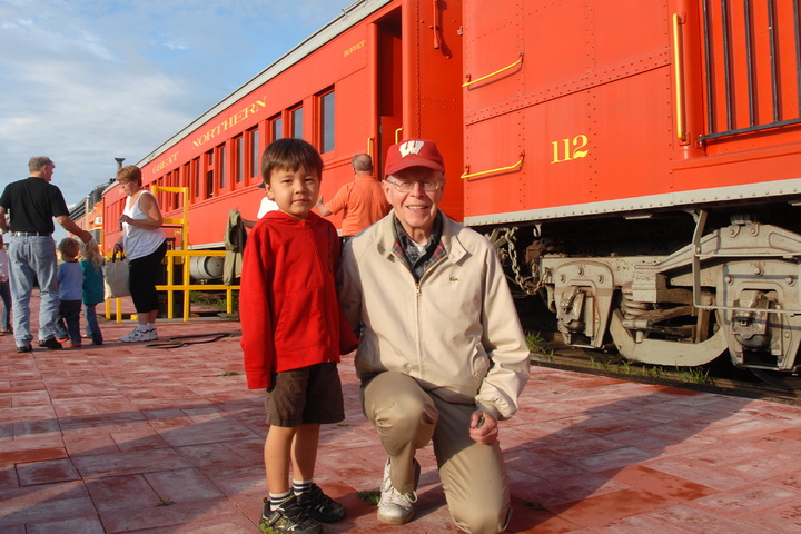 with Grandpa in front of train