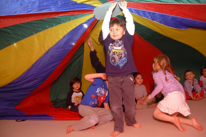 holding up the parachute tent
