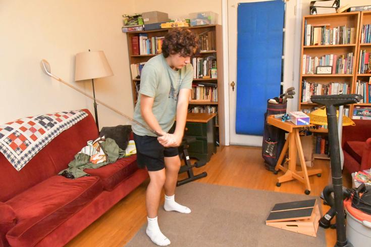 practicing his swing